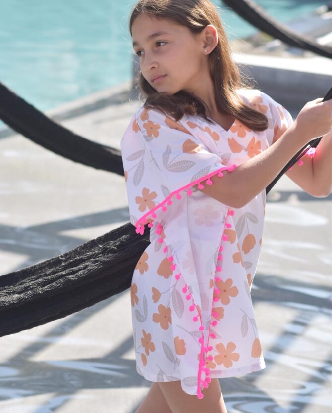 girl wearing a kaftan in pool