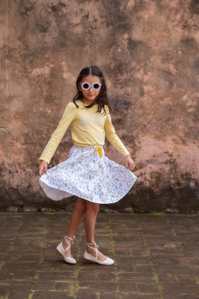 Girl twirling in her white skirt