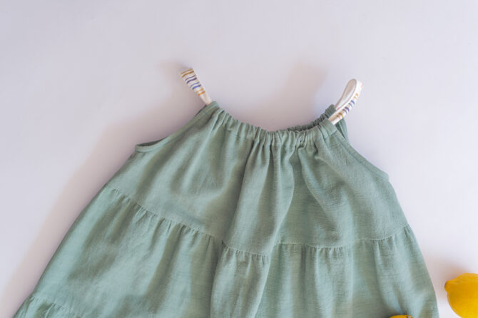 Flatlay of green dress