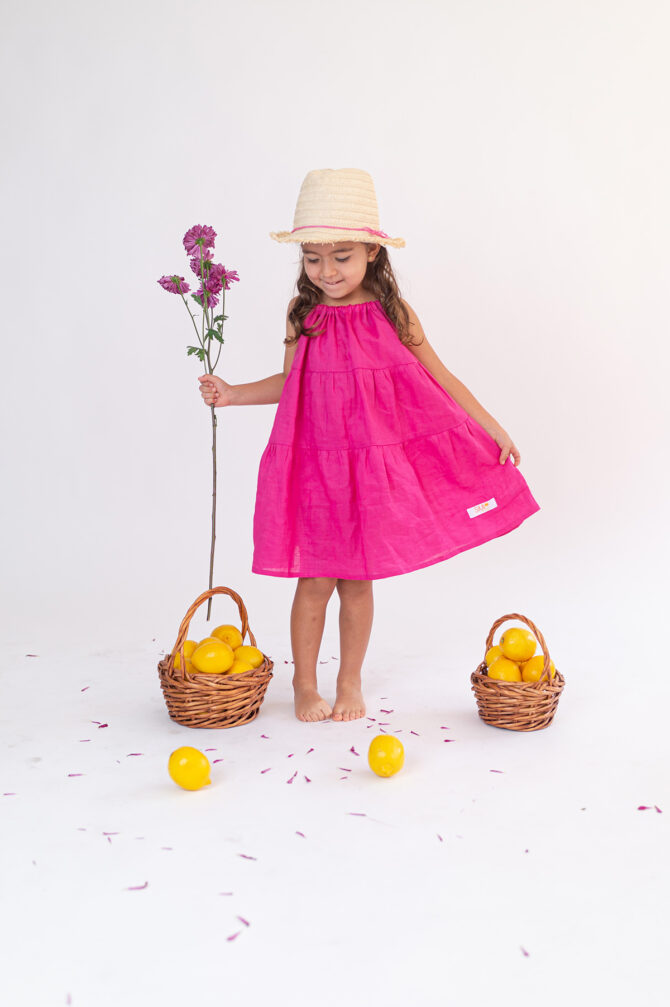 girl in pink linen dress