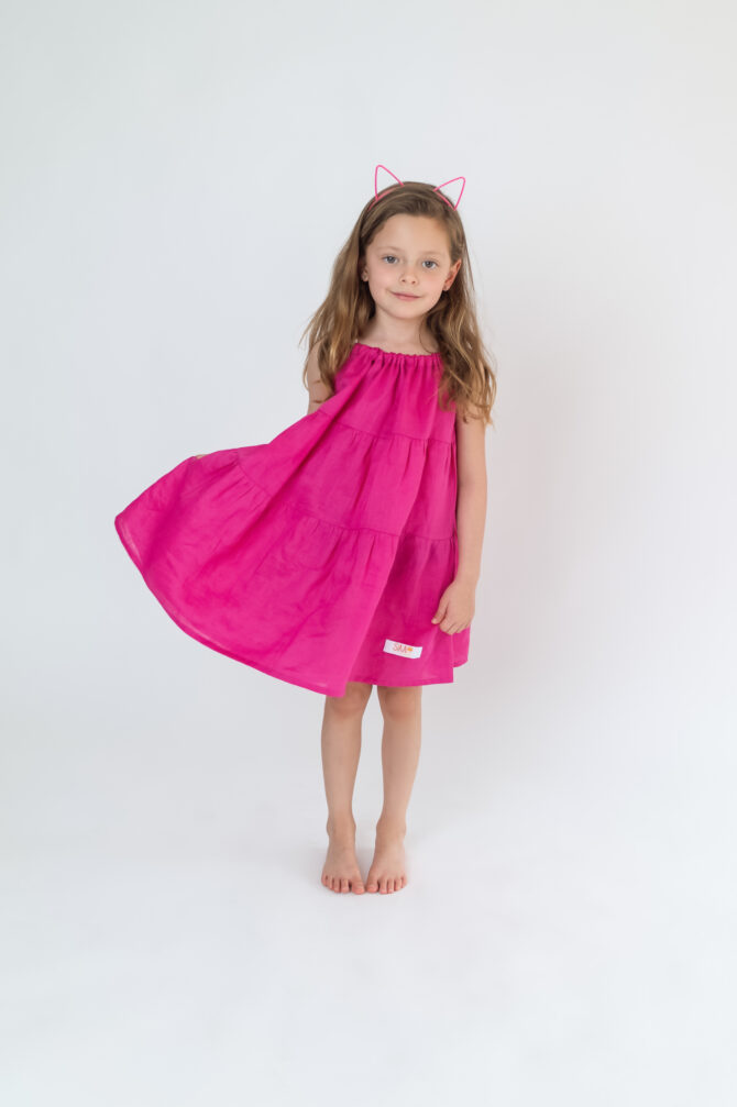 girl in pink linen dress